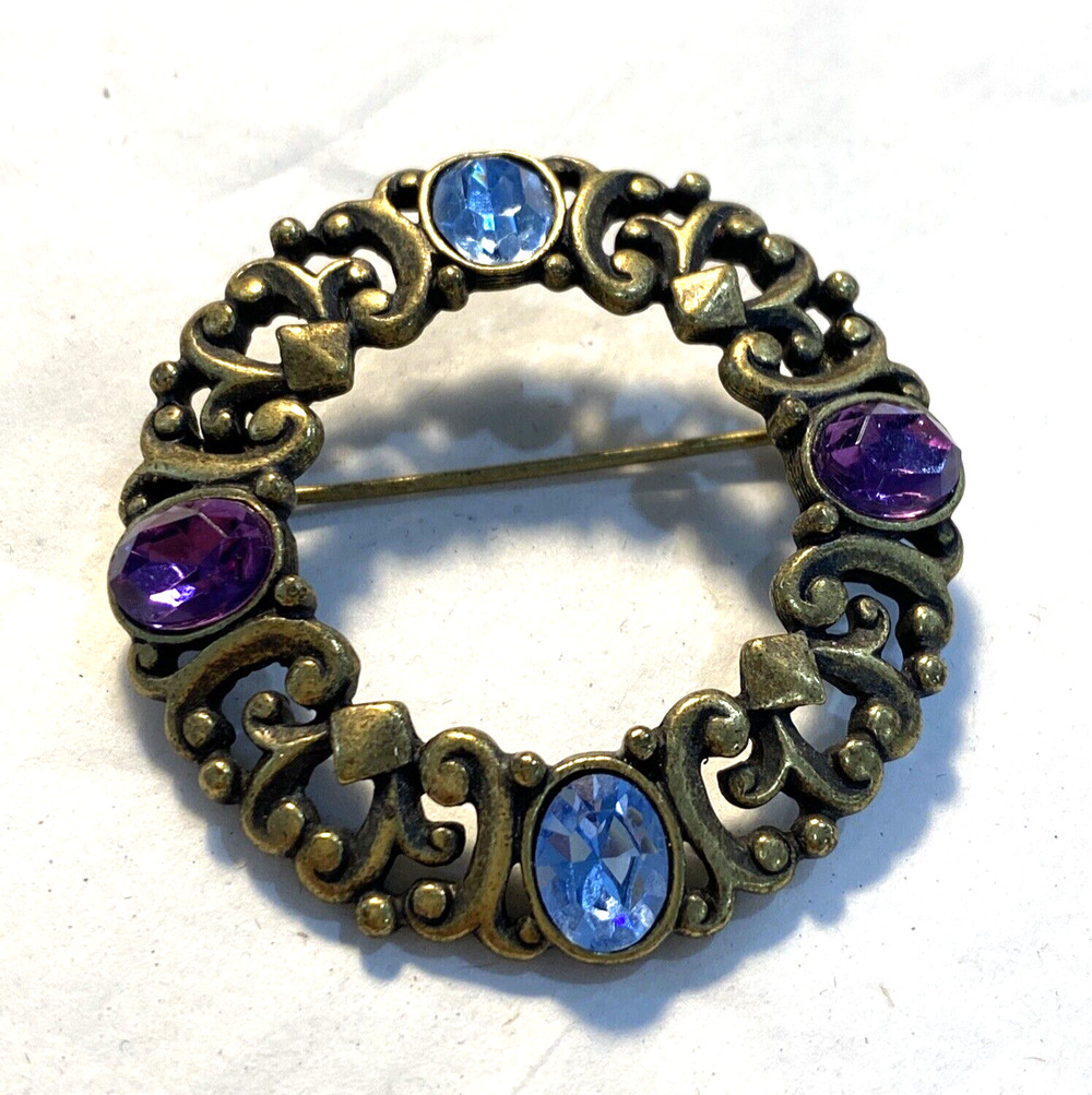 Vintage wreath brooch celtic motif ornate goldtone pin blue and purple stones